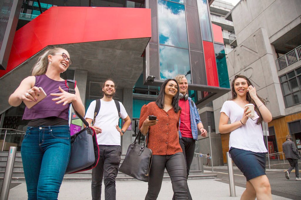 Students walking outside Swinburne University building